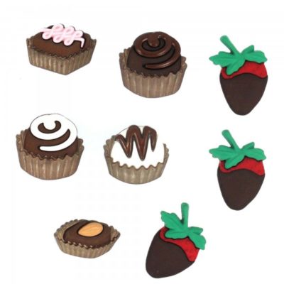Chocolate covered strawberries, candies and chocolate buttons